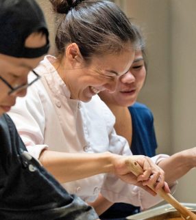 Jessica VanRoo cooking with students