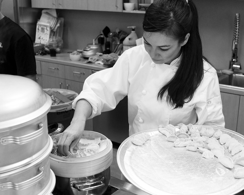 Jessica VanRoo cooking dumplings black and white